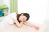 woman resting on desk